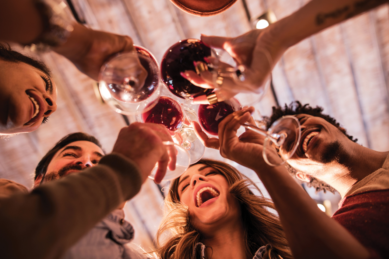 A group of people celebrating with wine