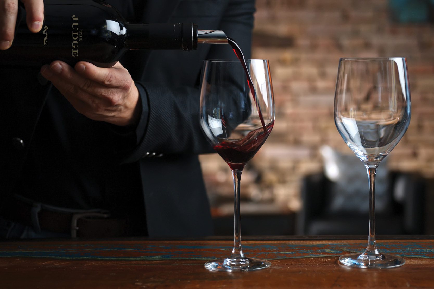 Man pouring wine into a glass